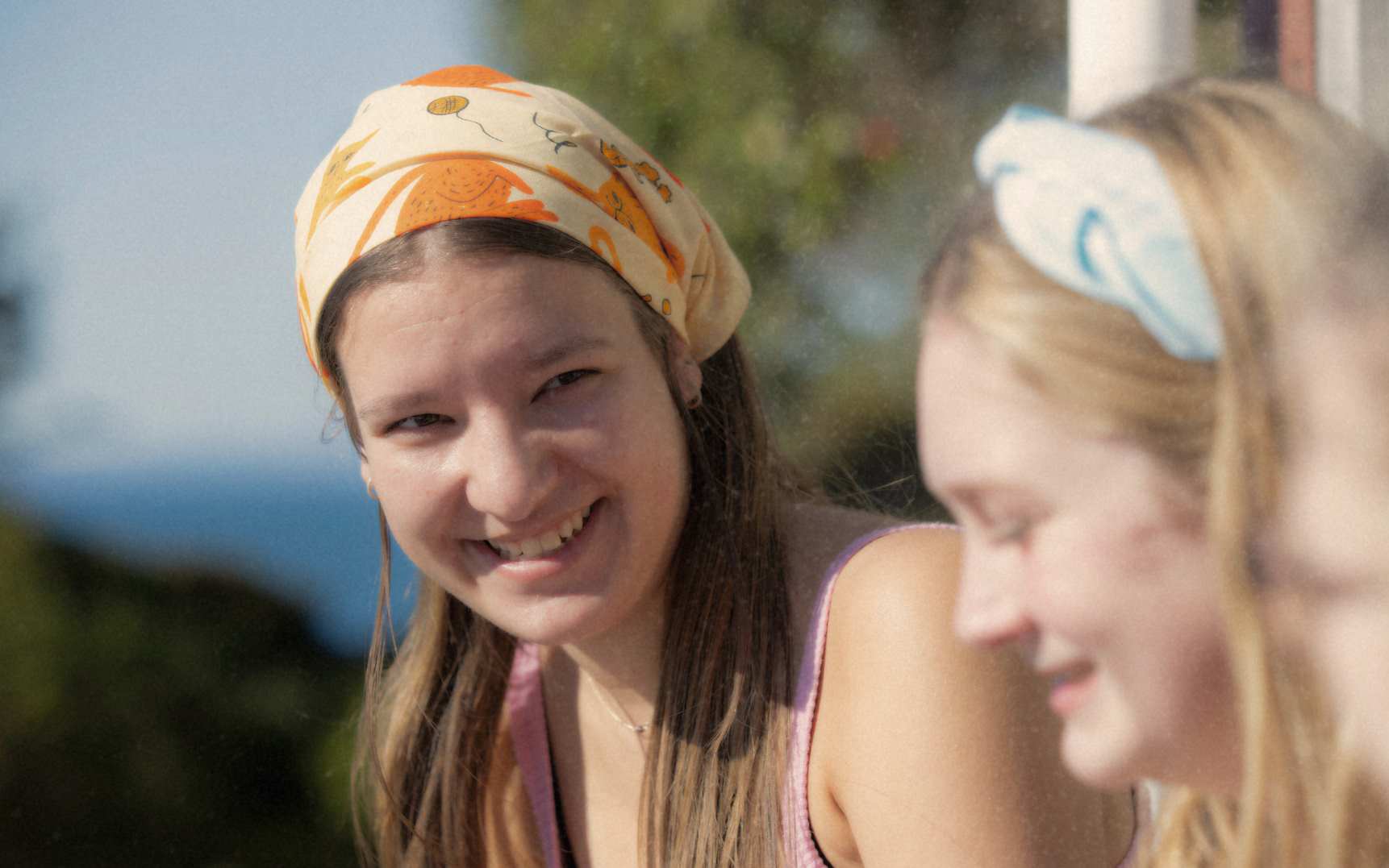 two rangatahi wearing bandannas in support of canteen