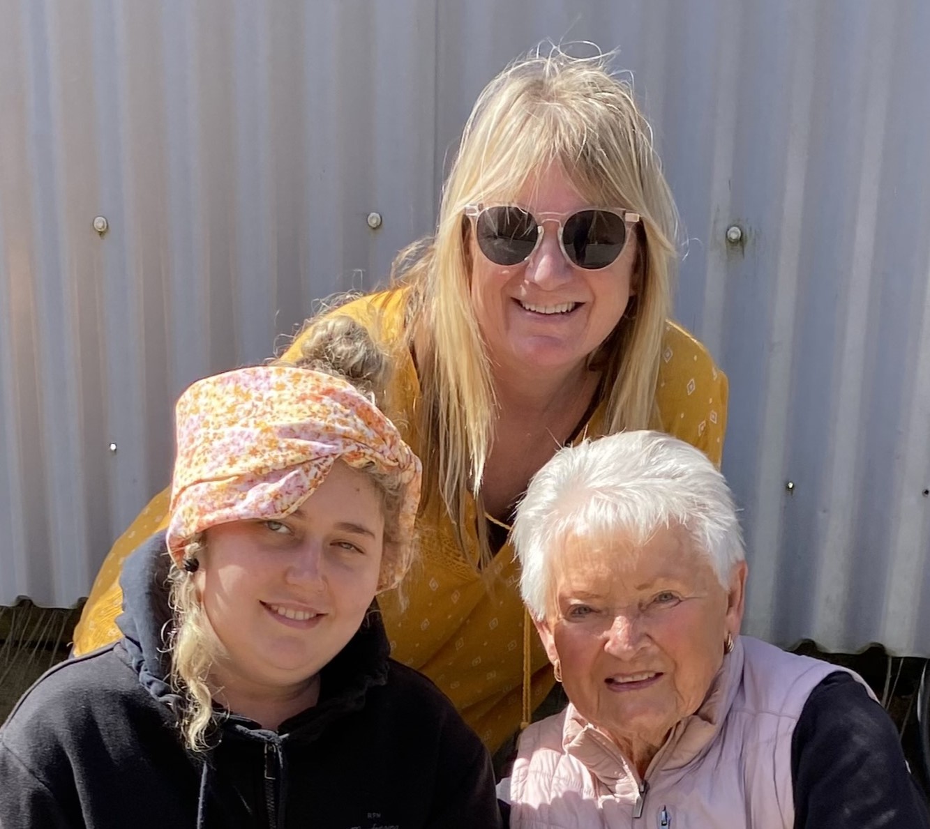 Canteen member Melanie, smiling with family members